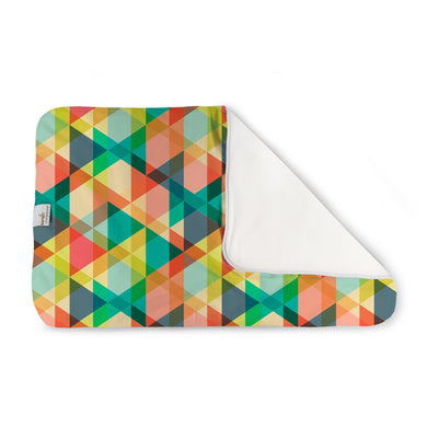 Finn Changing Pad - triangle geometric print in yellow, greens, blue, and orange